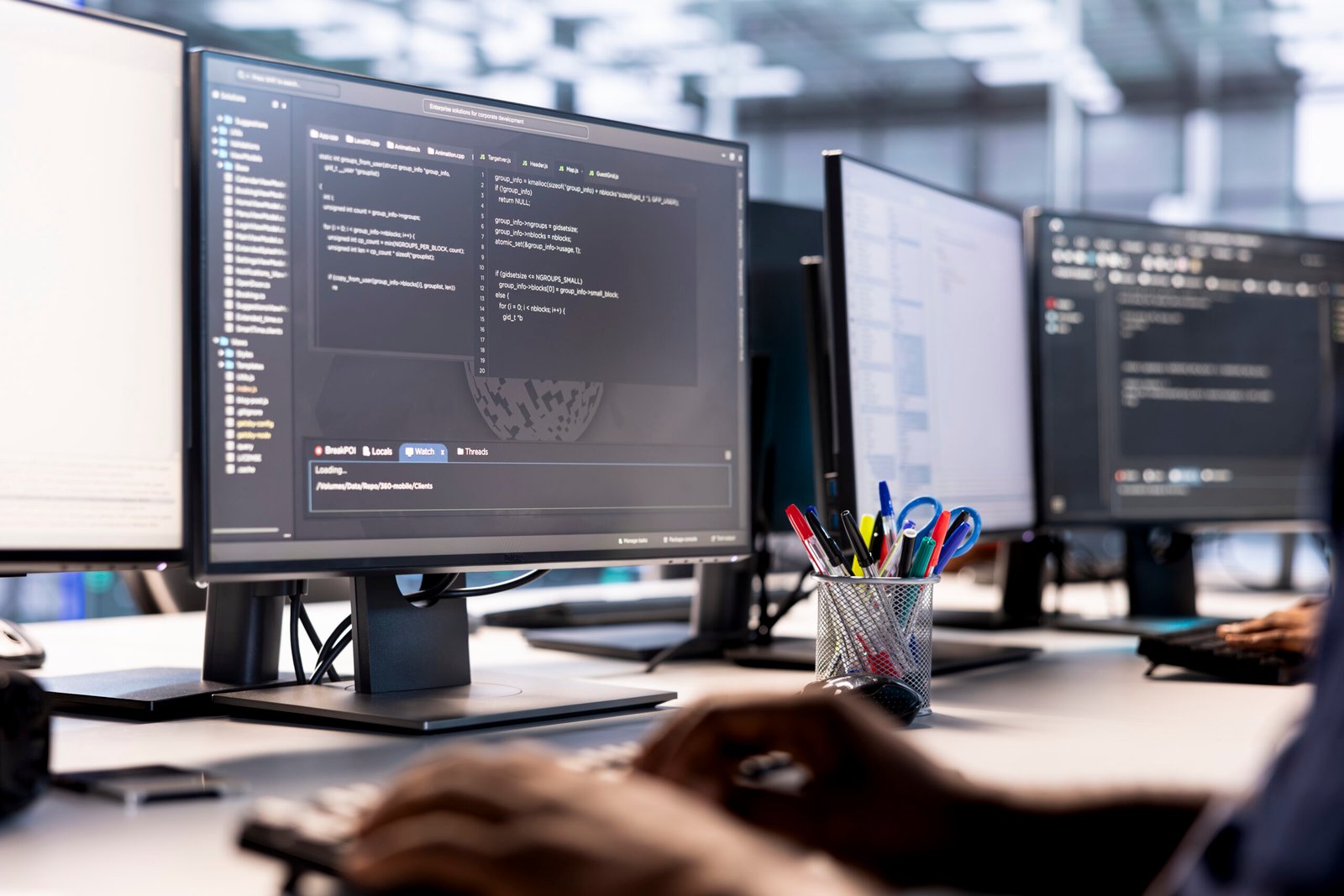 Data center technician using programming languages on PC to construct algorithms and build applications. Close up of server hub IT professional debugging and optimizing code